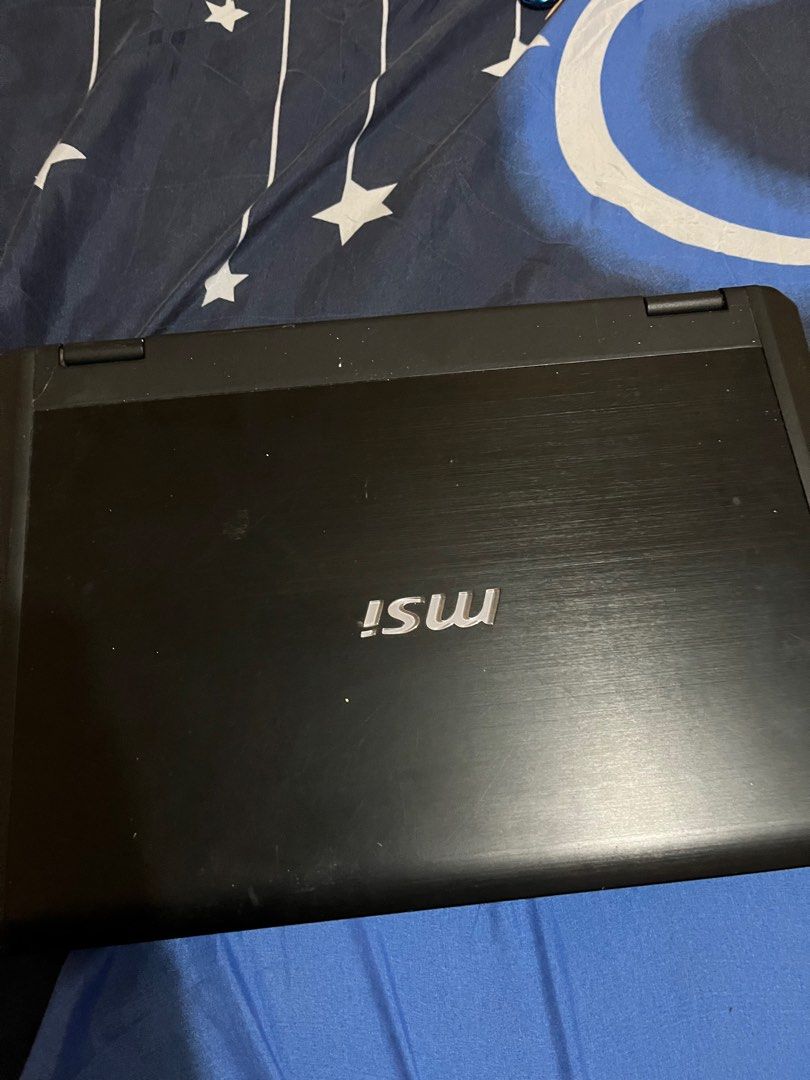 MSI GAMING LAPTOP GX60 (Category: Laptops & Notebooks) located in Las Pinas. Submitted by jamesmortilla (Listing ID 1313376981, Image 2). Description: MSI GAMING LAPTOP GX60 - Won’t turn on anymore. Needs repair. - I’m mainly selling this FOR PARTS - Used to run games like Fortnite, Fall Guys, and The Sims 4 without lag (as well as Adobe Apps like AE) - Keyboard is detached, it doesn’t work - Webcam doesn’t work either - Charger included rfs: dec