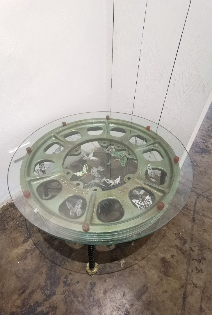 Upcycled industrial pulley low table (Category: Tables & Sets) located in Quezon City. Submitted by vintagespektroom (Listing ID 1313350131, Image 2). Description: For sale upcycled industrial pulley round low table in excellent condition 12mm tempered glass top Height 46cm Diameter 79cm if interested just message or call me 09171548596 Quezon city area Can ship at buyer's expense Mode of payment : Gcash/lalamove COD/Bank transfer..