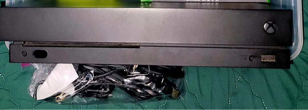 XBOX ONE X 1TB with (2) Wireless controllers and 6 games (Category: Xbox) located in Pasig City. Submitted by gracegorgeous (Listing ID 1313264294, Image 2). Description: XBOX ONE X 1TB with (2) Wireless controllers includes XBOX One games. 10,000k PHP GCash accepted (2) Wireless Controller with charge cords, and 2 Batteries. - HDMI and console power cord. Original XBOX console box Not included. Includes: (5) XBOX ONE Games original covers and al