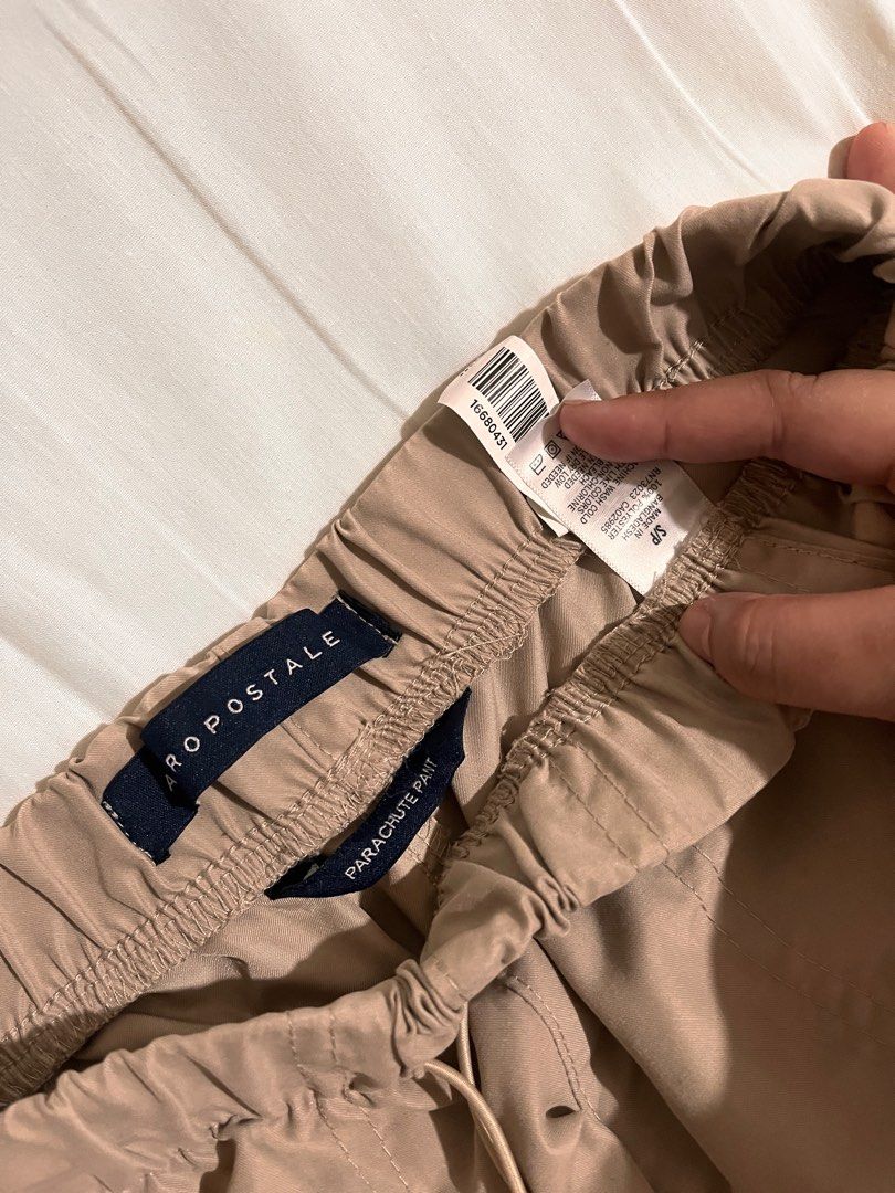Aeropostale Parachute pants (Category: Other Bottoms) located in Quezon City. Submitted by leisdeclutter (Listing ID 1317545490, Image 2). Description: Bought for 20cad, selling for only 750php 2 pockets only, in front. slight stretch, very adjustable the length is 43in if stretched, 34in if not stretched, 27in.