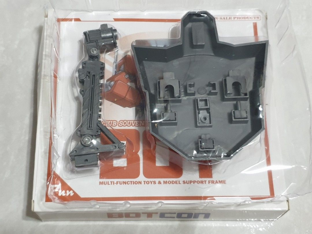 Botcon Multi-Function Toys & Model Support Frame (Category: Gundam Model Kits) located in Singapore. Submitted by sideswipe77 (Listing ID 1317646808, Image 3). Description: 1 x Brand new (Opened to check and take photos) - $8 Spare connection joints are kept below the base..