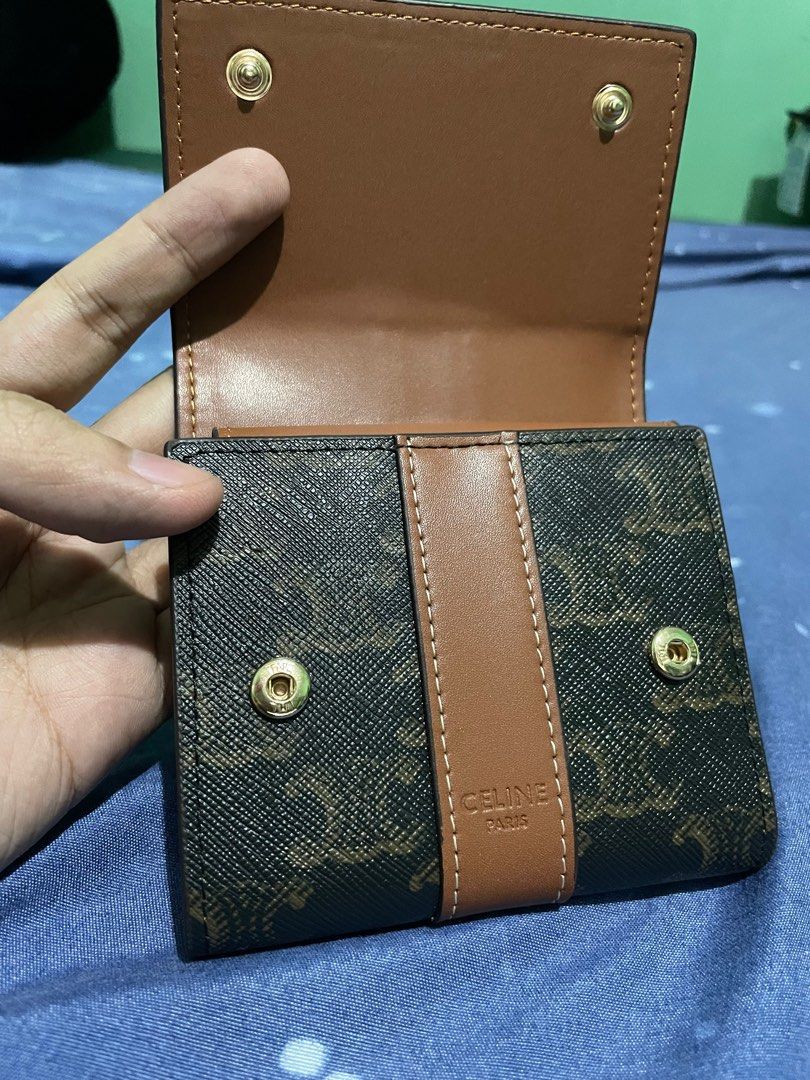 CELINE WALLET (SMALL TRIFOLD WALLET IN TRIOMPHE CANVAS) (Category: Luxury Bags & Wallets) located in Quezon City. Submitted by jakescollection (Listing ID 1317669507, Image 3). Description: CELINE SMALL TRIFOLD WALLET IN TRIOMPHE CANVAS Dimensions: 10.5 x 8.5 x 4 CM flap closure with snap buttons 5 card slots 1 cash pocket 1 coin purse Includes box, dust bag and chain strap.