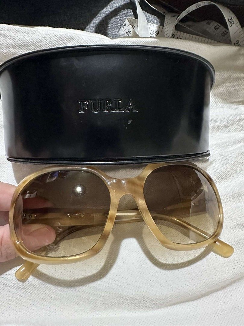 Furla - Sunglasses (Category: Sunglasses & Eyewear) located in Quezon City. Submitted by offthesehands (Listing ID 1317689322, Image 1). Description: Brand: Furla (Authentic from Japan) Color: brown/tan Type: sunglasses Size: - Price: Slightly Negotiable Usage: with slight micro scratches but still looks new RFS: Decluttering DM if interested | Will only entertain questions related to the item.