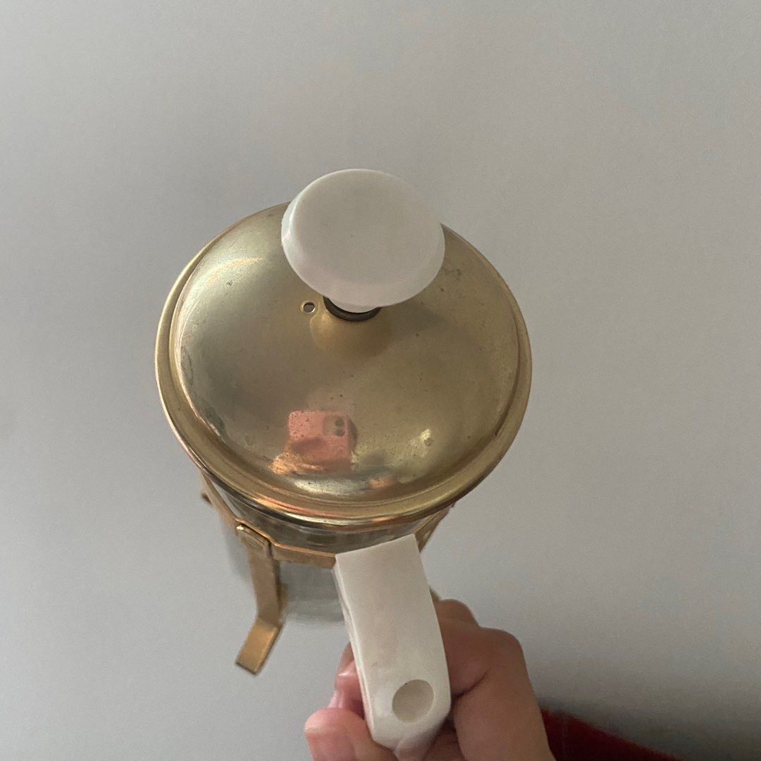 Gold Coffee Press (Category: Coffee & Tea Tableware) located in Taguig. Submitted by nessyyy (Listing ID 1317597275, Image 3). Description: Issue: may chipped sa may taas (included in the 4th photo) Mode of Delivery: Thru lalamove and jnt only Mode of Payment: Gcash only .