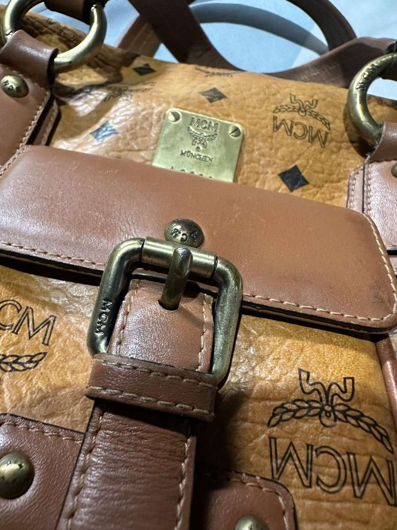 MCM - Germany (Category: Luxury Bags & Wallets) located in Quezon City. Submitted by offthesehands (Listing ID 1317692196, Image 3). Description: Brand: MCM Germany Color: cognac Type: boston bag Size: 27cm Price: non negotiable Usage: rank AB, no cracks, with signs on usage, clean interiors RFS: Decluttering DM if interested | Will only entertain questions related to the item.