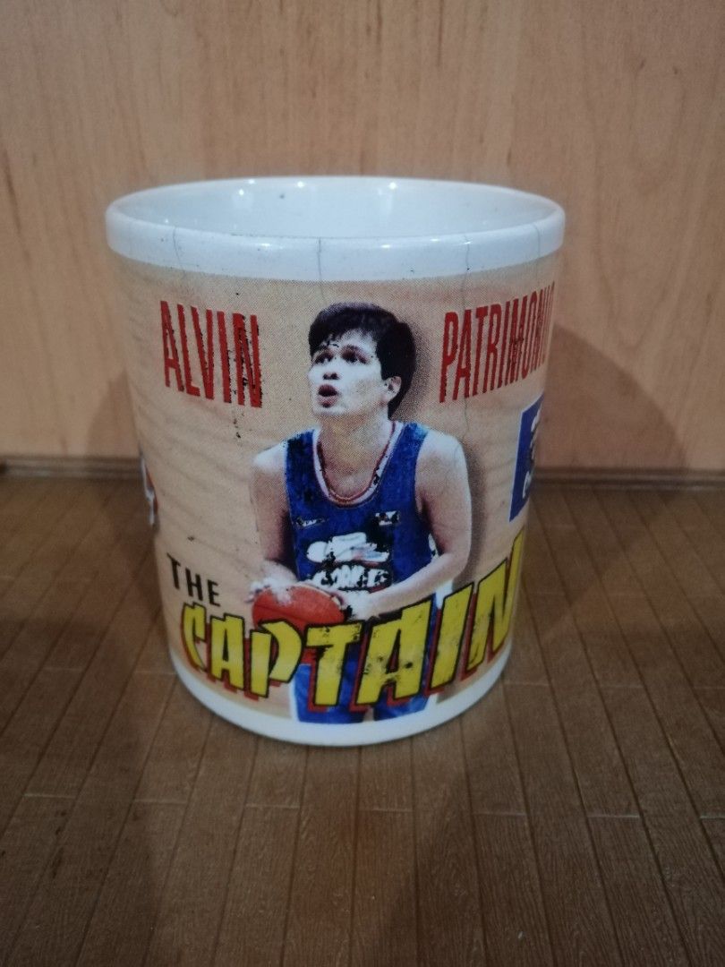 PBA Alvin Patrimonio coffee mug (Category: Coffee & Tea Tableware) located in Quezon City. Submitted by goldencity1964 (Listing ID 1317679508, Image 1). Description: Selling this vintage authentic licensed OFFICIAL PBA ALVIN PATRIMONIO THE CAPTAIN COFFEE MUG Year Released 1987 Purefoods Corned Beef Cowboys Text for meet up.