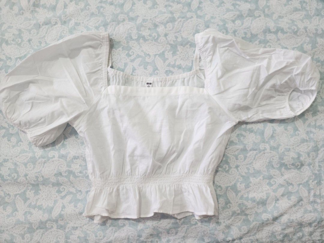 Uniqlo puff sleeve top (Category: Blouses) located in Cebu City. Submitted by kfc40 (Listing ID 1317608094, Image 1). Description: size M but i had it altered to a smaller size. can fit S-xs. lightly used. very good condition.