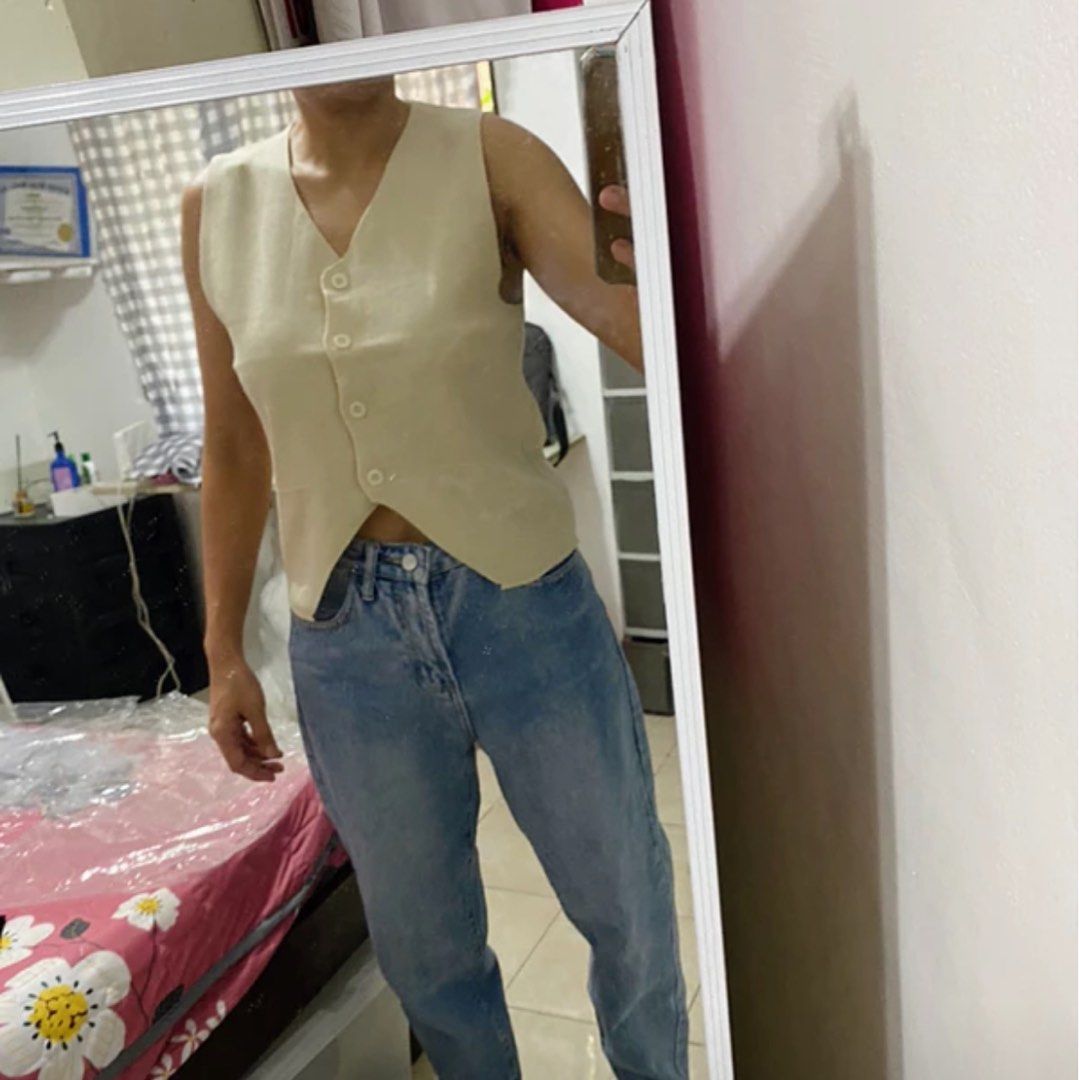 Button-up V-shape Hem V-neck Knitted Top cream ONHAND (Category: Sleeveless) located in Manila. Submitted by everythinchic (Listing ID 1319230468, Image 3). Description: Button-up V-shape Hem V-neck Knitted Top Cream on hand Knitted fabric, thick soft big stretch, super comfy to wear V-neck design & V-shape hem Working buttons at front Free size fits small to large 7 colors Good quality Bust: 82cm~102cm Waist: 82cm~102cm Length: 50cm Please allow