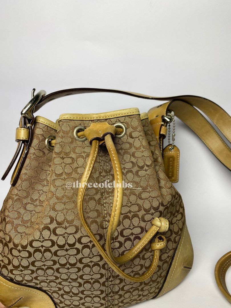 Coach Small Brown Monogram Drawstring Crossbody Bag (Category: Luxury Bags & Wallets) located in Quezon City. Submitted by threeofclubs__ (Listing ID 1319224632, Image 2). Description: Very good condition 100% GA Clean body Clean interior, can fit large phones Adjustable strap No major rubs No stains No cracks Normal signs of wear always double check and zoom photos Aproximate dimensions: 8.8” L x 9.0” H ♣ 1 day reservation only. ♣ Please manage 