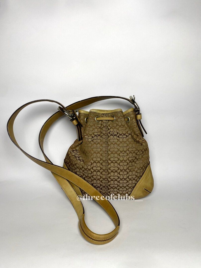 Coach Small Brown Monogram Drawstring Crossbody Bag (Category: Luxury Bags & Wallets) located in Quezon City. Submitted by threeofclubs__ (Listing ID 1319224632, Image 3). Description: Very good condition 100% GA Clean body Clean interior, can fit large phones Adjustable strap No major rubs No stains No cracks Normal signs of wear always double check and zoom photos Aproximate dimensions: 8.8” L x 9.0” H ♣ 1 day reservation only. ♣ Please manage 