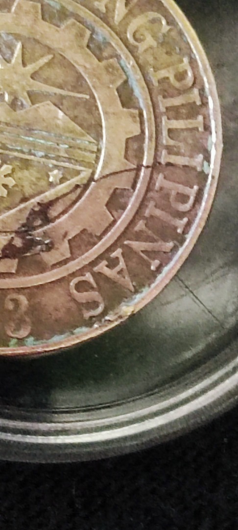 25 sentimo Coins error there's a metal cover the year and hairline ...