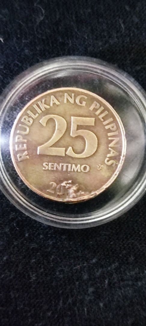 25 sentimo Coins error there's a metal cover the year and hairline ...