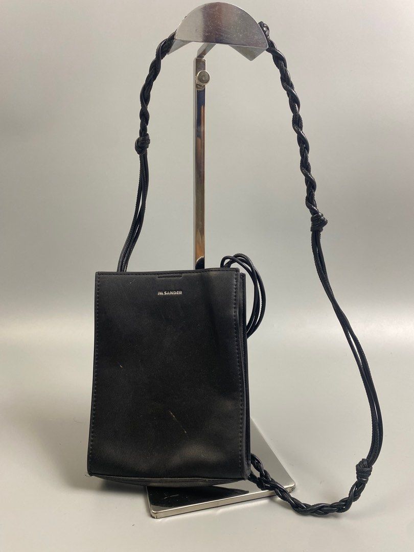 Jil Sander Tangle Leather CrossBody Bag Black (Category: Luxury Bags & Wallets) located in Quezon City. Submitted by lucky.purelux.ph (Listing ID 1319313225, Image 1). Description: Jil Sander Tangle Leather CrossBody Bag Black 🏷️ 6000 Rank AB Free shipping within Metro Manila Additional shipping charges for provincial deliveries Please read the description before buying MOP: gcash, bank transfer (bpi) Courier: J&T, lalamove Please view all uploa