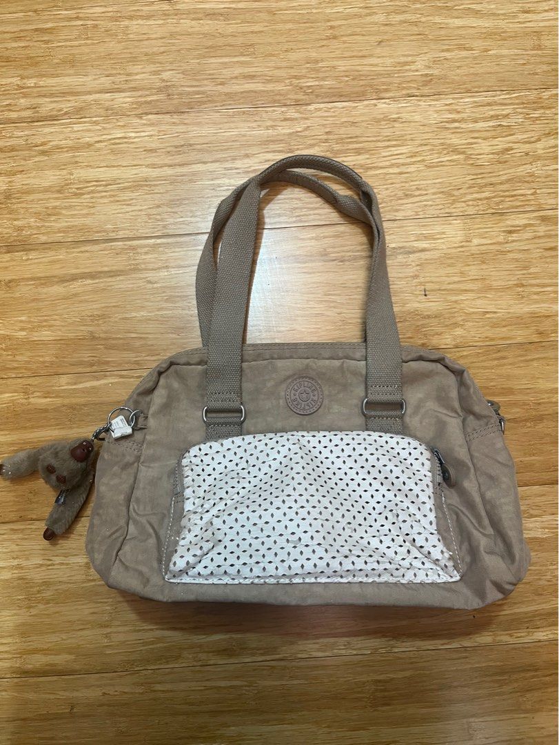 Kipling Beige Shoulder Cross Body Sling Bag (Category: Shoulder Bags) located in Quezon City. Submitted by hazpreloved (Listing ID 1319192444, Image 1). Description: Original price is 3K+ Bought this in the US, well used Quality is still great, as most kipling bags There’s slight peeling on the leather parts but barely noticeable from afar Comes with a longer strap RFS: decluttering tags: kipling longchamp coach guess kate spade backpack shoulder