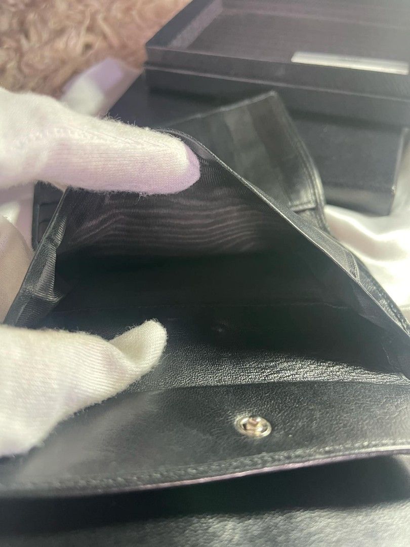 PRADA Tri-fold wallet with box and card (Category: Luxury Bags & Wallets) located in Dagupan City. Submitted by japanorigitems (Listing ID 1319228051, Image 3). Description: PRADA Tri-fold wallet/--/BLK/plain/ladies/3M1 comes with box and cards Just arrived from J.A.P.A.N GUARANTEED Original ₱10,000.