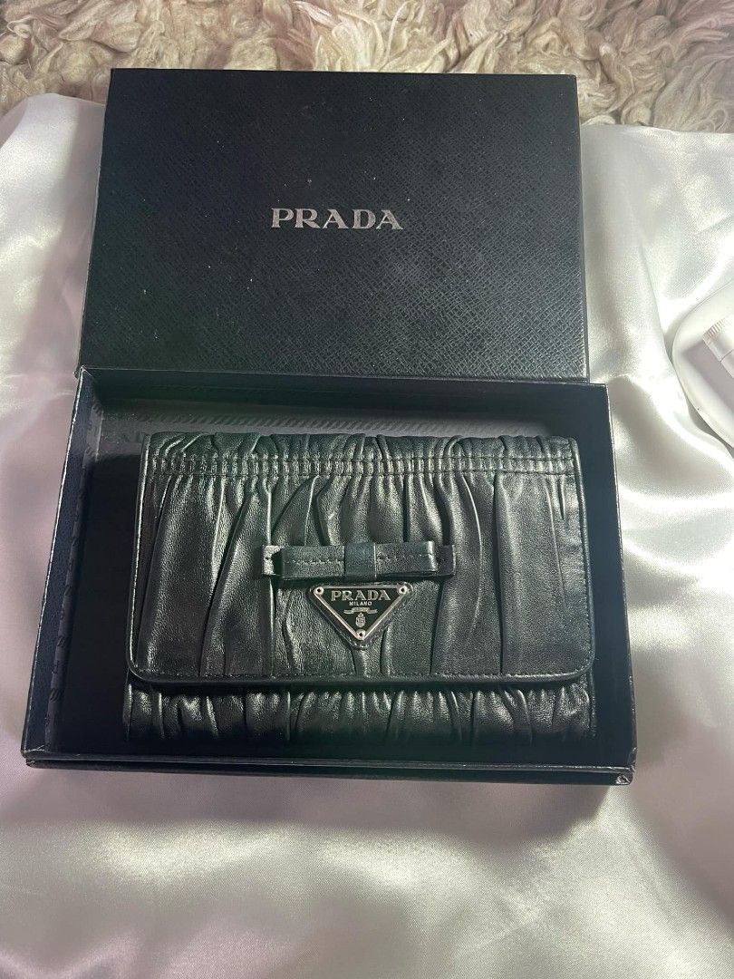 PRADA Tri-fold wallet with box and card (Category: Luxury Bags & Wallets) located in Dagupan City. Submitted by japanorigitems (Listing ID 1319228051, Image 1). Description: PRADA Tri-fold wallet/--/BLK/plain/ladies/3M1 comes with box and cards Just arrived from J.A.P.A.N GUARANTEED Original ₱10,000.