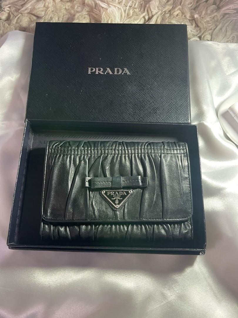 PRADA Tri-fold wallet with box and card (Category: Luxury Bags & Wallets) located in Labrador. Submitted by bagwalletaccessoriesfromjapan (Listing ID 1319259757, Image 1). Description: PRADA Tri-fold wallet with box and card new arrival from J.A.P.A.N P10,000 ONLY .