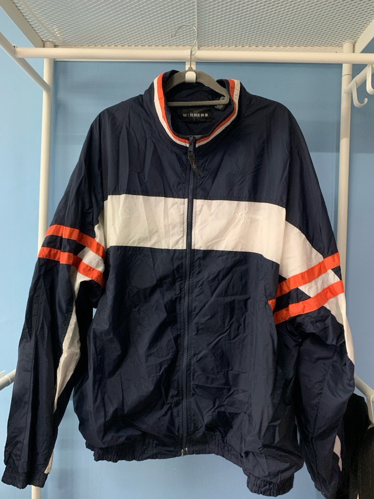 orange white and blue nike windbreaker