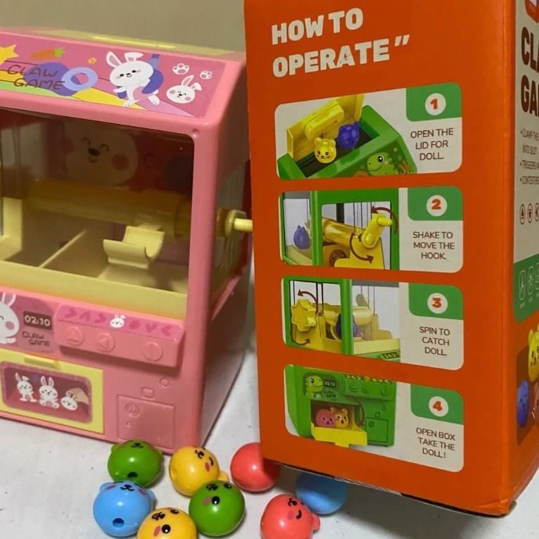 Mini claw machine, super cute and easy to play (Category: Interactive Toys) located in Caloocan City. Submitted by plushiestation (Listing ID 1319566328, Image 3). Description: 🌸 super kawaii 💕 ✨ size: 10.5 x 7.5 x 15.3 cm ✨ does NOT need batteries to play, batteries are optional for sound effects but aren't needed for the game! ✨ played with only once then kept in box ✨ complete inclusions! no damage, like brand new ✨ bought for ₱299 on Sh🍊pe