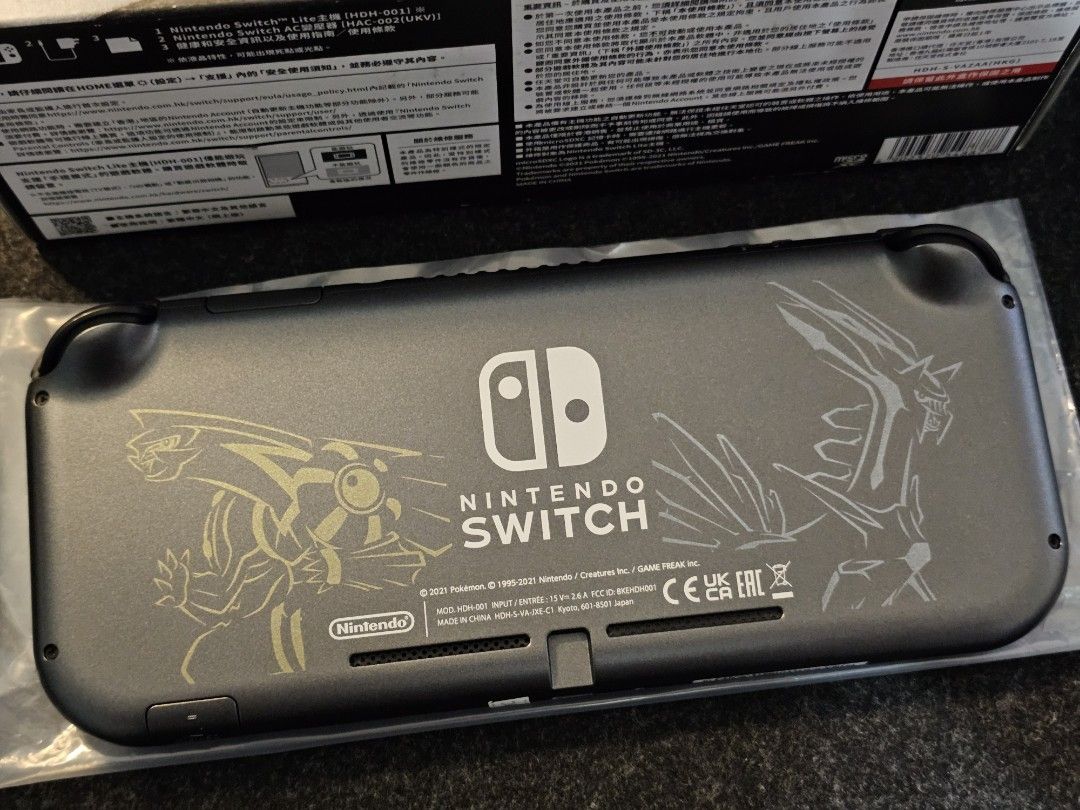 Nintendo Switch Lite Dialga and Palkia Edition (Category: Nintendo) located in Paranaque City. Submitted by john020497 (Listing ID 1319672155, Image 3). Description: - Smooth unit. Around 9.5/10 smoothness. - Complete with charger, box and manuals. - Rare unit. Good item for collectors. Parañaque area. Delivery via Lalamove/Grab..