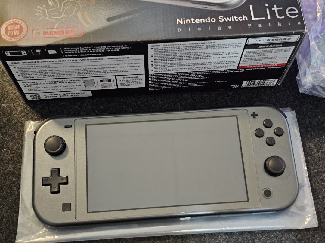 Nintendo Switch Lite Dialga and Palkia Edition (Category: Nintendo) located in Paranaque City. Submitted by john020497 (Listing ID 1319672155, Image 2). Description: - Smooth unit. Around 9.5/10 smoothness. - Complete with charger, box and manuals. - Rare unit. Good item for collectors. Parañaque area. Delivery via Lalamove/Grab..