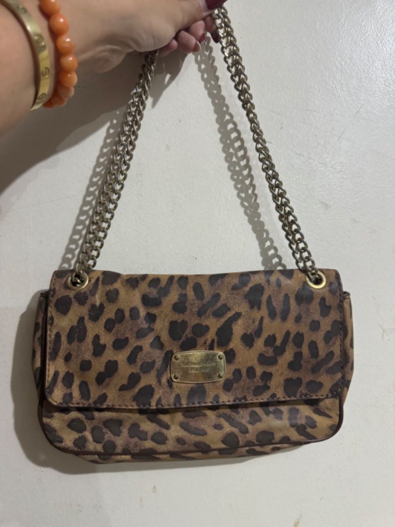 Preloved mk sling leopard print bag (Category: Luxury Bags & Wallets) located in Binan City. Submitted by maharlikasonlineshop (Listing ID 1319681809, Image 1). Description: Preloved mk sling bag Can be worn in two way.