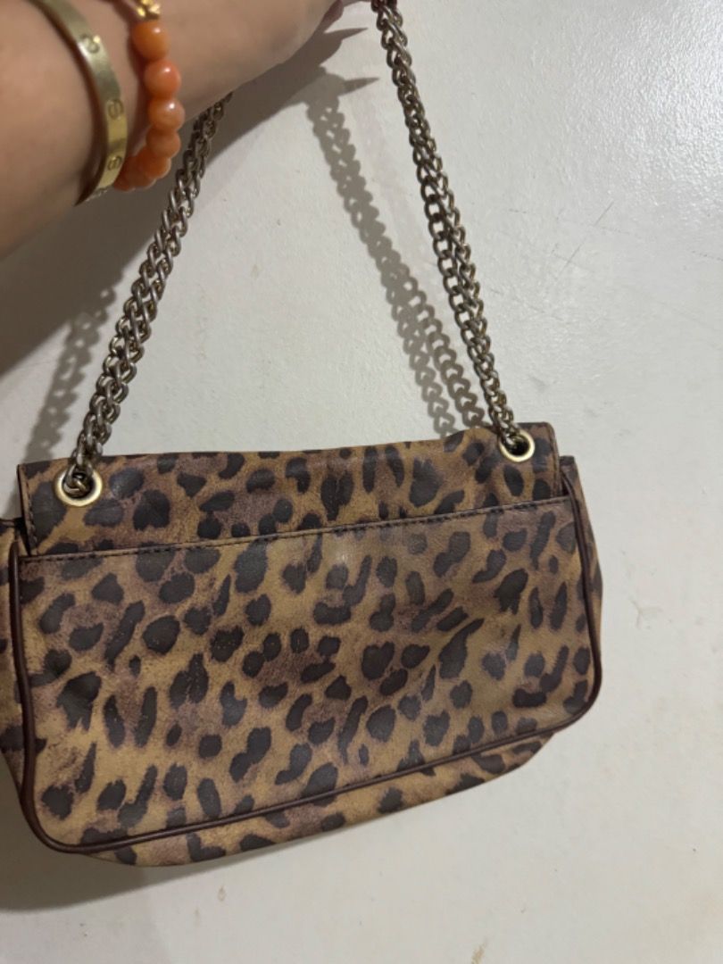 Preloved mk sling leopard print bag (Category: Luxury Bags & Wallets) located in Binan City. Submitted by maharlikasonlineshop (Listing ID 1319681809, Image 2). Description: Preloved mk sling bag Can be worn in two way.