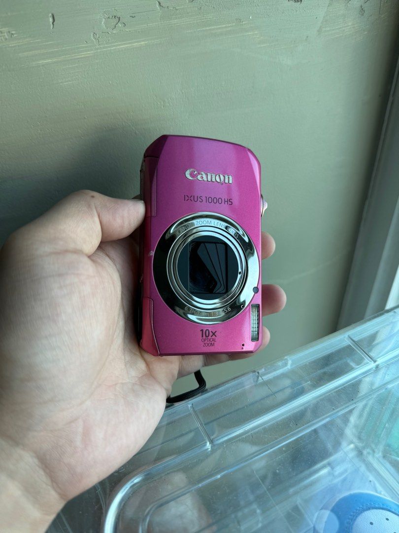 Canon Ixus 1000 HS (Category: Cameras) located in Valenzuela. Submitted by iramndz (Listing ID 1319769717, Image 1). Description: Canon Ixus 1000 HS - 10 MP - 10x Optical Zoom - buttons, flash is working - Body cosmetics 9/10 issue: Sobrang vignette ng screen pero di nakakaaffect sa output. lens curtain half lang ung nagcclose. .