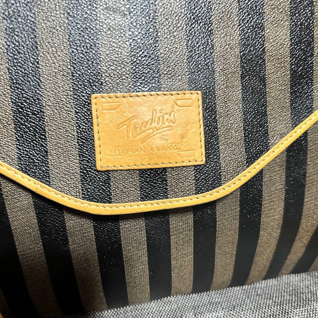 Tacchini italy document bag (Category: Luxury Bags & Wallets) located in Manila. Submitted by greyinfash06839 (Listing ID 1319867935, Image 2). Description: 🤍Price: 3,999 pesos only 🤍Item: Tacchini italy document bag 🤍Brand: Tacchini italy 🤍Matirial: Leather 🤍Quality: Original 🤍color: Brown 🤍Size: Large 🤍Dimension. H: 11 L: 15 W: 3 🤍Sex: For men 🤍Issue: Sign of use 🤍Condition Rate: 9/10 🤍Other info:.