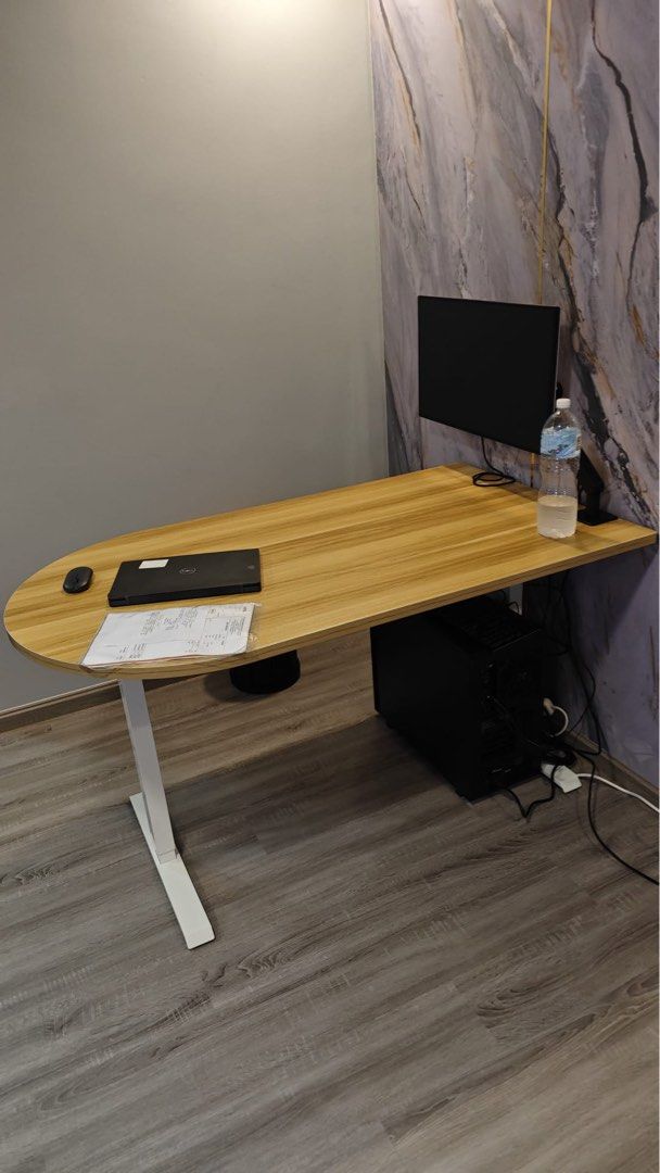 Adjustable computer desk (Category: Tables & Sets) located in Singapore. Submitted by sameer.goodkid (Listing ID 1306016465, Image 3). Description: Auto adjustable tablet up to 110 cm adjustable height. Cool looking highly functional table. Also can customize. Wooden table and metal frame. Need to pre order.