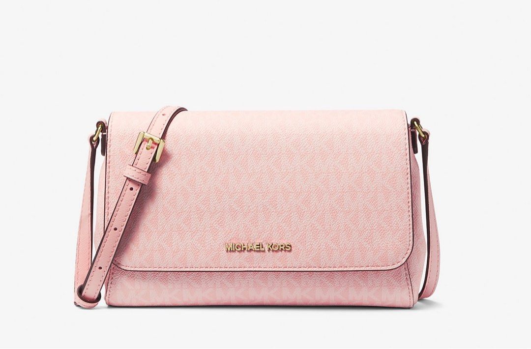 Authentic Michael Kors crossbody bag medium logo 🇺🇸 (Category: Cross-body Bags) located in Cavite. Submitted by fordeclutter (Listing ID 1320048420, Image 1). Description: Authentic MK bought here in California 🇺🇸 Color: powder blush • 89.4% coated canvas/9.6% polyester/1% polyurethane • Trim: 100% leather • Gold-tone hardware • 9”W X 5.75”H X 2.25”D • Adjustable measurement: 22.5”-24.5” • Exterior details: back slip pocket, removable strap •