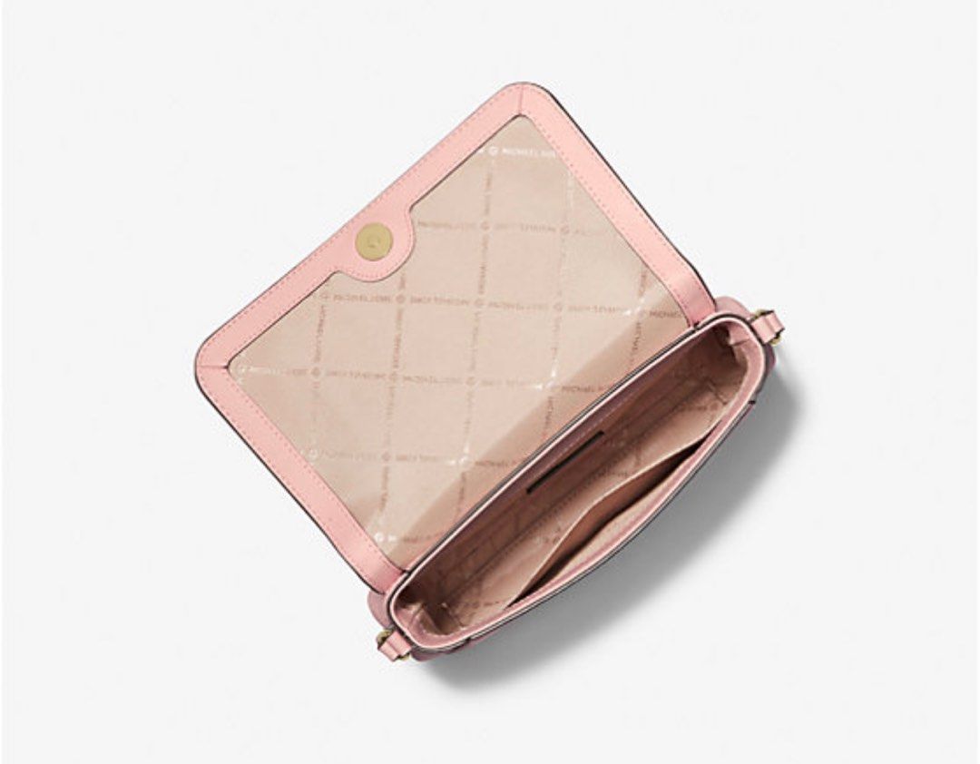 Authentic Michael Kors crossbody bag medium logo 🇺🇸 (Category: Cross-body Bags) located in Cavite. Submitted by fordeclutter (Listing ID 1320048420, Image 2). Description: Authentic MK bought here in California 🇺🇸 Color: powder blush • 89.4% coated canvas/9.6% polyester/1% polyurethane • Trim: 100% leather • Gold-tone hardware • 9”W X 5.75”H X 2.25”D • Adjustable measurement: 22.5”-24.5” • Exterior details: back slip pocket, removable strap •