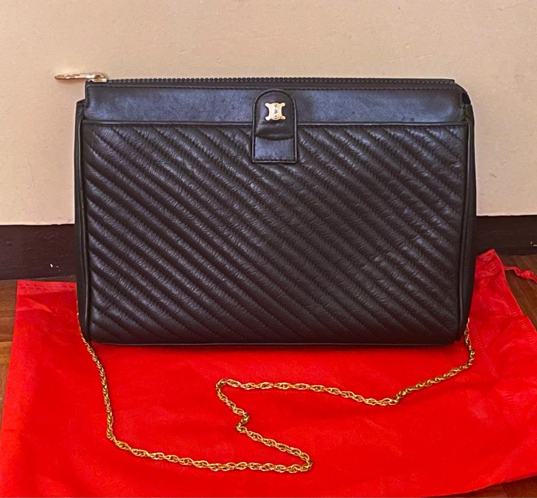 Celine Blason Logo Leather Clutch (Category: Luxury Bags & Wallets) located in Cavite. Submitted by HelloAnn_Closet (Listing ID 1312689120, Image 3). Description: Celine Blason Logo Leather Clutch. Pinalagyan ko ng sling, changed the chain sling, Super pretty. Saw this on other selling sites for ₱16-20k or more .