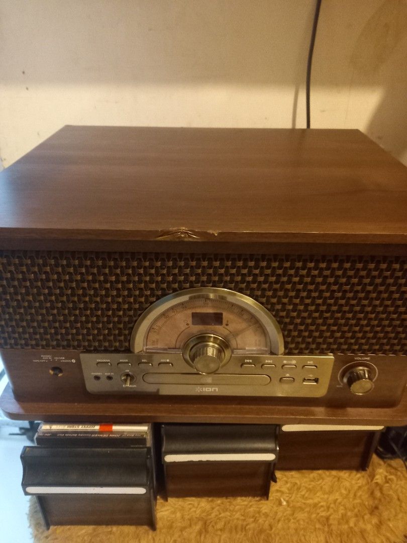 ION SUPERIOR TURNTABLE (Category: Portable Music Players) located in Manila. Submitted by richardlee51903 (Listing ID 1319914982, Image 1). Description: ion superior turntable lahat umaandar namn..radio cd cassette turntable USB at Bluetooth. issue isang knobs nawala at kahoy lng may tapas kunti..