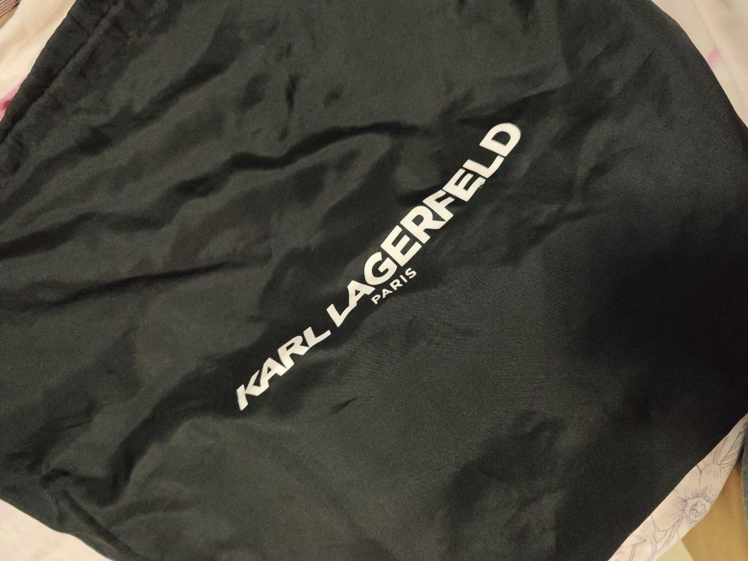 KARL LAGERFELD (Category: Luxury Bags & Wallets) located in Pasig City. Submitted by calybrown (Listing ID 1319962870, Image 1). Description: karl lagerfeld black in gold hardware slight hairline scratches on hardwares with dustbag.