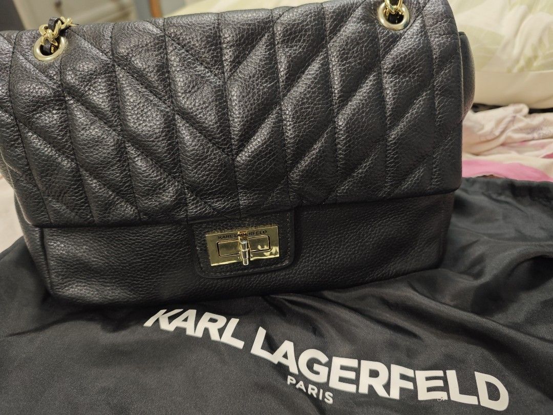 KARL LAGERFELD (Category: Luxury Bags & Wallets) located in Pasig City. Submitted by calybrown (Listing ID 1319962870, Image 2). Description: karl lagerfeld black in gold hardware slight hairline scratches on hardwares with dustbag.