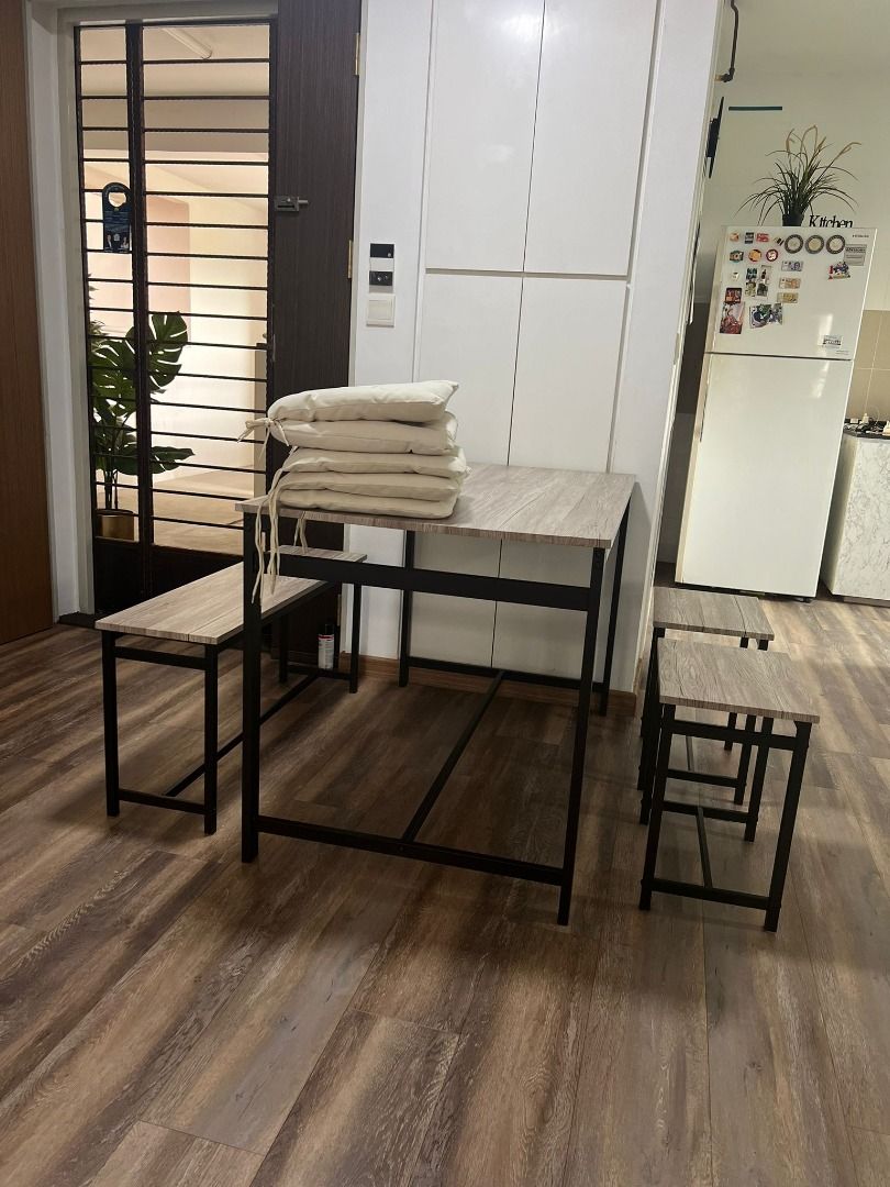 Dining Table (Category: Tables & Sets) located in Singapore. Submitted by les_conflict (Listing ID 1319897314, Image 1). Description: With 5 free cushion seats as seen in pictures Product Description - 1 x Table , 2 x stools , 1 x bench Table dimensions - Height: 75.3cm - Width: 120cm - Depth: 70cm Stool dimensions - Height: 45.3cm - Width: 40cm - Depth: 28cm Bench dimensions - Height: 45.3cm - Width: 98cm - Depth: 28cm.