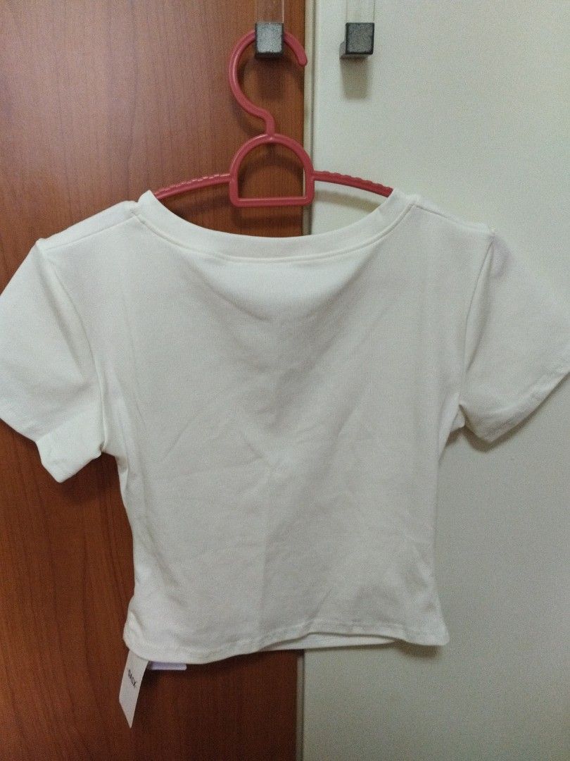 White top (Category: Shirts) located in Singapore. Submitted by kwntt (Listing ID 1319905740, Image 4). Description: shoulder 38cm bust 34cm length w 42cm.
