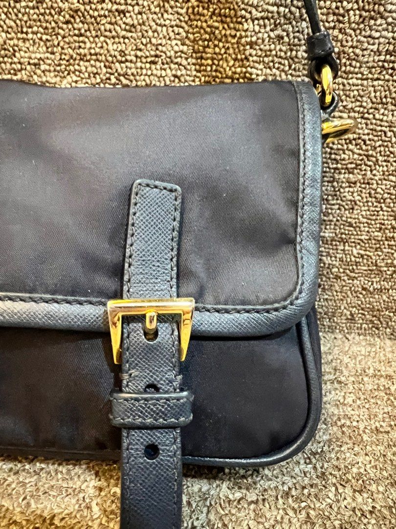 Rush sale Authentic prada nylong sling bag blue (Category: Luxury Bags & Wallets) located in Malolos. Submitted by humanpink77 (Listing ID 1320193494, Image 2). Description: Tessuto Nylon Saffiano Small Messenger Bag Blue With original dustbag and certificate from legit grails Lost cards Navy blue 7/10 condition rank ab+ Gold hardware, some part a bit faded Strap with minimal flaws on the glazing(photo posted) but no crackings Base length: 9.50 i