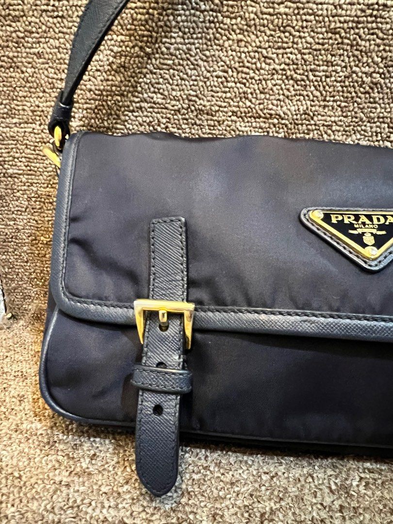 Rush sale Authentic prada nylong sling bag blue (Category: Luxury Bags & Wallets) located in Malolos. Submitted by humanpink77 (Listing ID 1320193494, Image 3). Description: Tessuto Nylon Saffiano Small Messenger Bag Blue With original dustbag and certificate from legit grails Lost cards Navy blue 7/10 condition rank ab+ Gold hardware, some part a bit faded Strap with minimal flaws on the glazing(photo posted) but no crackings Base length: 9.50 i