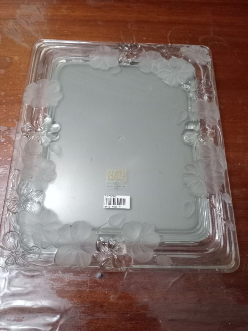 Fifth Avenue crystal photo frame (Category: Frames & Pictures) located in Marikina City. Submitted by lynx1972 (Listing ID 1320222541, Image 1). Description: Fifth avenue crystal photo frame Heavy ; with embossed flower design Selling at a low price bec its box is already dilapidated.