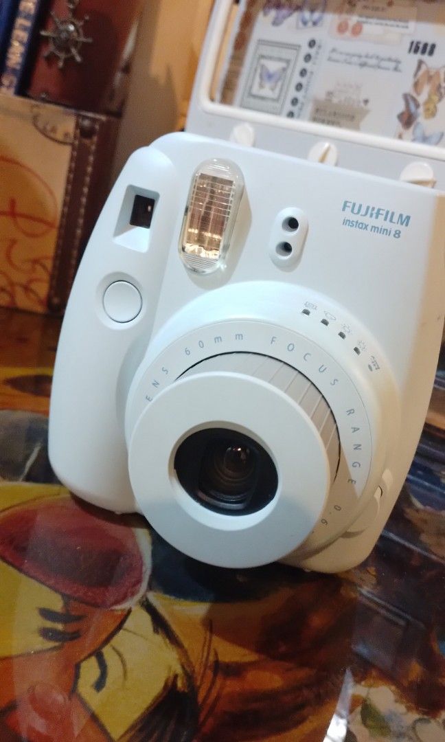 Pre-loved Instax Mini 8 with Case & Batteries (Category: Cameras) located in Quezon City. Submitted by jenchipotle (Listing ID 1320146195, Image 2). Description: I am selling my pre-loved Instax Mini 8 for only 2000php. Comes in a hard case, includes batteries. Issue: Thin crack on the side (pls see last photo) but other than that, perfectly working Please be reminded not to use ordinary batteries, this requires alkaline LR6 ones..