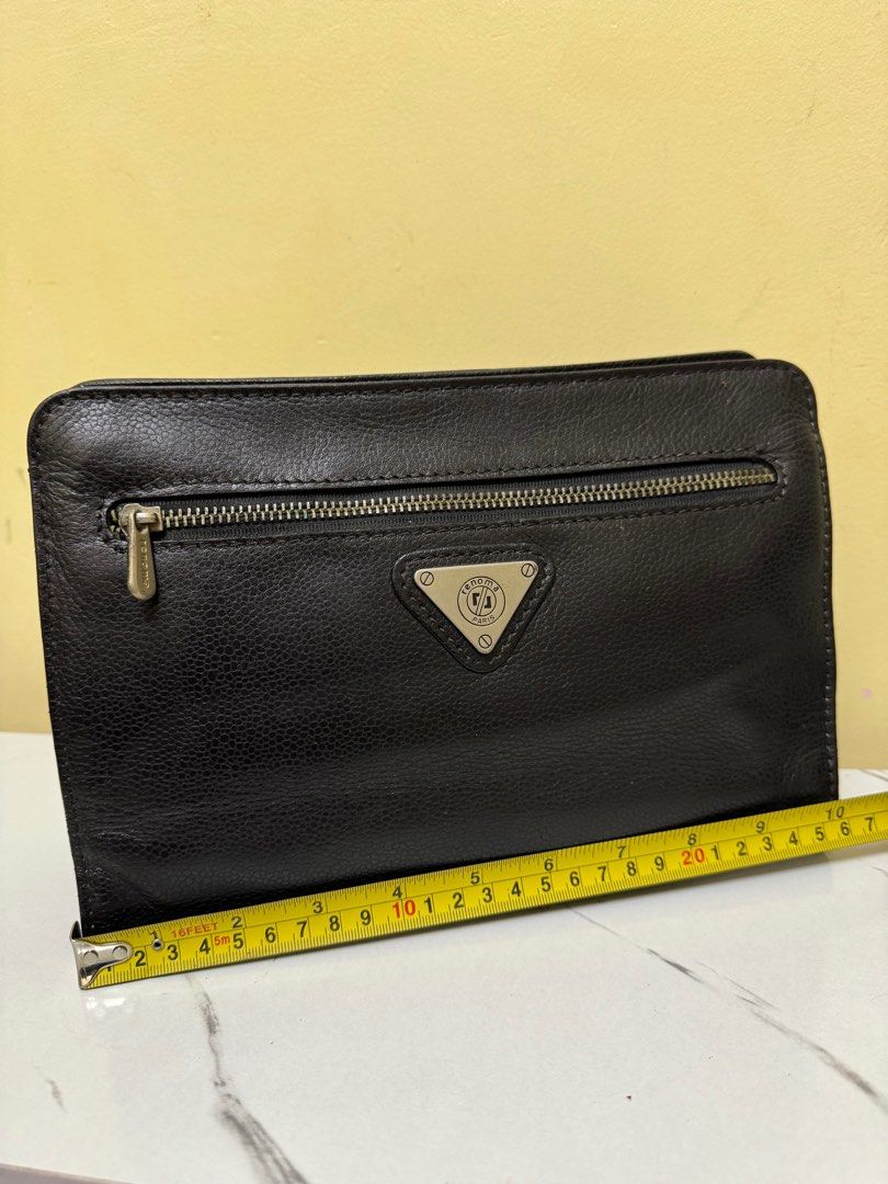 Renoma genuine leather clutch (Category: Luxury Bags & Wallets) located in Rizal. Submitted by houseofbell (Listing ID 1320157480, Image 3). Description: Excellent condition No flaws.