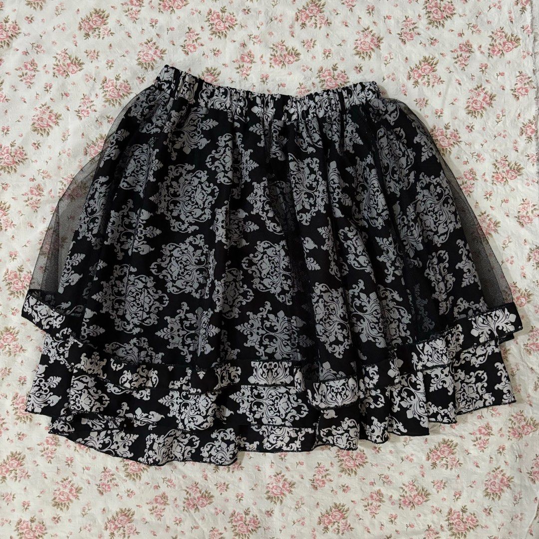 Black and white layered mesh skirt (Category: Skirts) located in Las Pinas. Submitted by squirrelsells (Listing ID 1320303085, Image 1). Description: garterized with inner shorts fits xs-m.