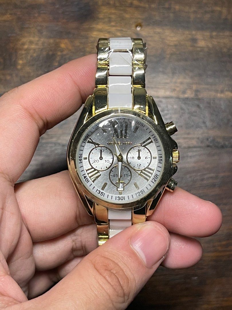 CLASS A Michael Kors MK5743 Watch (Category: Women's Watches) located in Pasig City. Submitted by iammivm (Listing ID 1320378963, Image 3). Description: CLASS A PRODUCT of MK5743 Bradshaw Chronograph White Dial Two-tone Ladies Watch Need to replace the battery Brand New Quartz (Battery) COLOR - Gold / White CASE SIZE - 43 mm CASE THICKNESS - 13 mm CASE MATERIAL - Stainless Steel CASE SHAPE - Round CASE BACK - Solid .