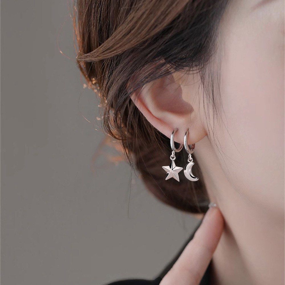 Asymmetrical star earrings sales