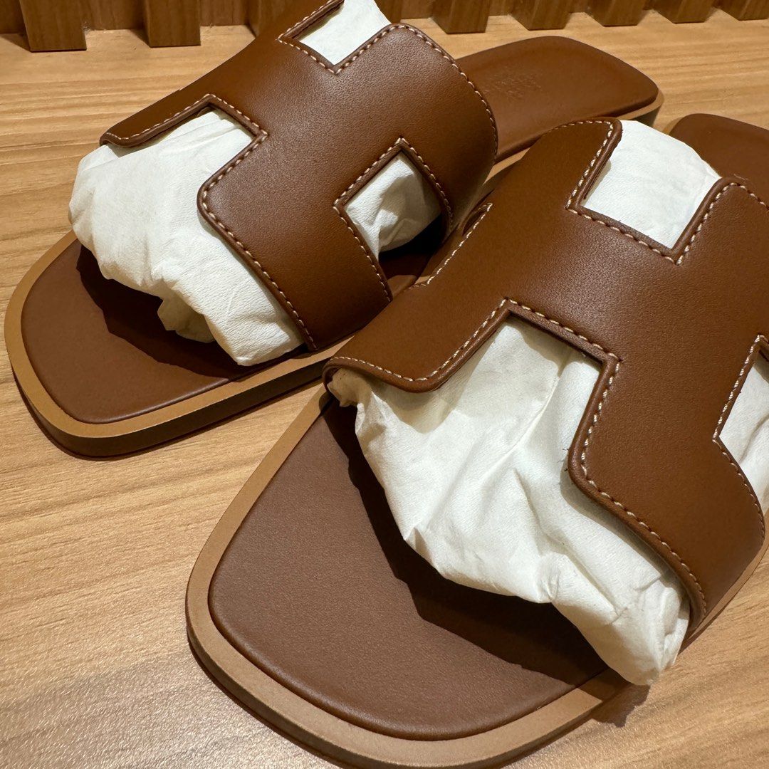 Hermes Oran Sandals Gold 37/37.5/38 (Category: Sneakers & Footwear) located in Singapore. Submitted by missbrownbear (Listing ID 1320313872, Image 2). Description: Comes with full set including copy of 2025 Receipt Size 37 Size 37.5 Size 38.
