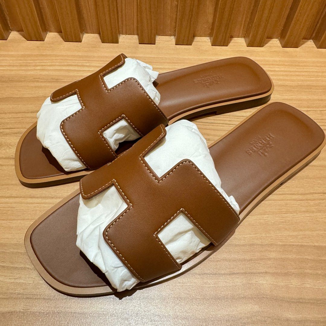 Hermes Oran Sandals Gold 37/37.5/38 (Category: Sneakers & Footwear) located in Singapore. Submitted by missbrownbear (Listing ID 1320313872, Image 1). Description: Comes with full set including copy of 2025 Receipt Size 37 Size 37.5 Size 38.