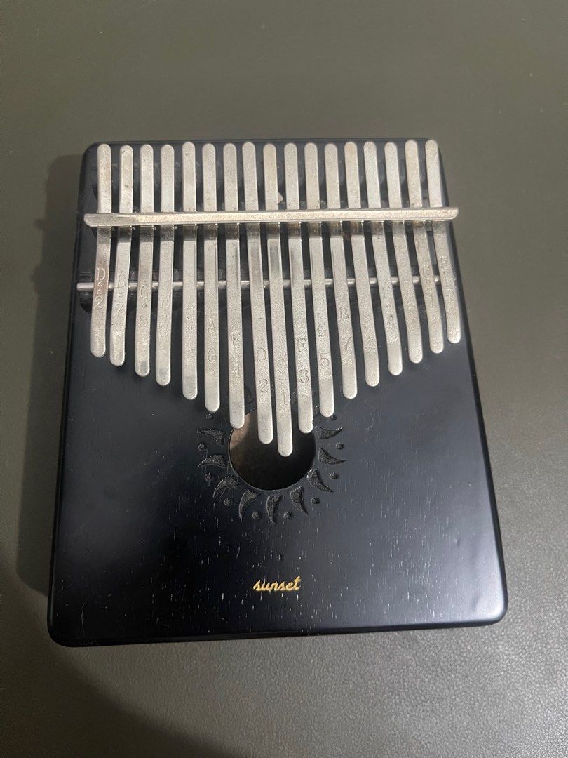 Kalimba - black wooden (Category: Musical Instruments) located in Quezon City. Submitted by jadeeclutterz (Listing ID 1320367646, Image 1). Description: READ UNTIL END: Wooden kalimba Purchased from Ben & Bart Has engraving of my pet’s name, pero generic naman Some marks sa metal due to exposure sa air nama-display lang kasi minsan) Including original pouch, tuning hammer, and box Note: - Posted price = LAST PRICE - Amount is negotiable ONLY IF y