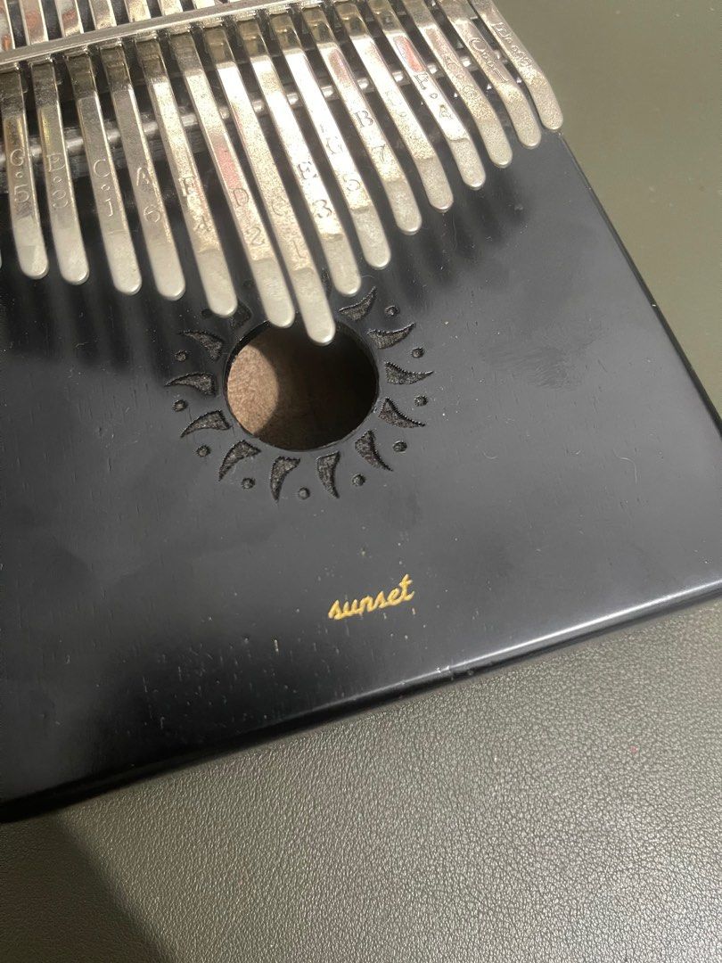 Kalimba - black wooden (Category: Musical Instruments) located in Quezon City. Submitted by jadeeclutterz (Listing ID 1320367646, Image 3). Description: READ UNTIL END: Wooden kalimba Purchased from Ben & Bart Has engraving of my pet’s name, pero generic naman Some marks sa metal due to exposure sa air nama-display lang kasi minsan) Including original pouch, tuning hammer, and box Note: - Posted price = LAST PRICE - Amount is negotiable ONLY IF y